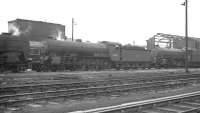 A section of the shed yard at Gateshead in 1963, with B16 4-6-0 no 61421 a visitor from York. The B16 is sandwiched between unidentified 9F and K1 class locomotives. One of the shed's recently arrived 'Peak' diesels can just be glimpsed in the background between the 9F and B16.<br><br>[K A Gray //1963]
