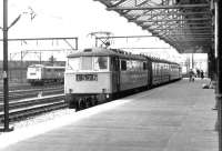 An Anglo-Scottish service arrives at Crewe on 26 April 1969 behind a class 86 electric locomotive, with another of the class standing in the background. <br><br>[John Furnevel 26/04/1969]