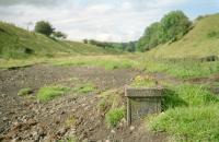 The remains of the distant signalpost for Borthwick Bank Signalbox in a view looking towards Edinburgh in 2002. 13 years on, it's a bit different here now.<br><br>[Ewan Crawford //2002]
