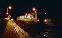 Northbound Sprinter pauses at Forsinard viewed from the north end of the station at night in 1994.<br><br>[Ewan Crawford 29/12/1994]
