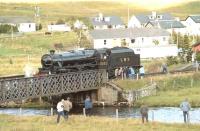 Black 5 5025 on the bridge over the River Bran just west of the platform at Achnasheen, where it paused to take on water on Saturday 25 September 1982. The locomotive was hauling the Scottish Steam Railtours Group <I>'Raven's Rock Express'</I> from Inverness to Kyle of Lochalsh. The special was advertised as <I>'The first public steam-hauled run to Kyle after an absence of 20 years'</I>.<br><br>[John Robin 25/09/1982]
