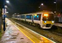 The late running 18.13 to Marylebone arrives at a soaking wet Haddenham and Thame Parkway on 6 November. I had arrived via the new curve at Bicester [see image 47183].<br><br>[Ken Strachan 06/11/2015]