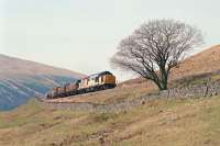 Southbound freight starting round the Horseshoe Curve south of Bridge of Orchy in 1991.<br><br>[Ewan Crawford //1991]