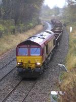 66063 nears Dalgety Bay with a Cowdenbeath - Mossend spent ballast train on a wet 15 November 2015.<br><br>[Bill Roberton 15/11/2015]