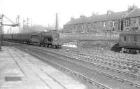 A Stirling-Edinburgh Princes Street train arrives at Larbert on 21 February 1953. The locomotive is Pickersgill ex-Caledonian 4-4-0 no 54503.<br><br>[G H Robin collection by courtesy of the Mitchell Library, Glasgow 21/02/1953]