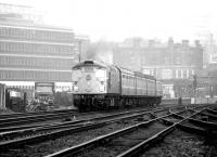 An unidentified type 2 takes a westbound train away from Haymarket on 25 April 1980. The train is passing between Haymarket coal depot on the left and Haymarket East Junction on the right.<br><br>[John Furnevel 25/04/1980]