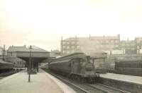 McIntosh ex-CaledonIan 0-4-4T 55168 with a city bound train at Maryhill Central in the summer of 1951. View is north east, with Maryhill Road running across the background.<br><br>[G H Robin collection by courtesy of the Mitchell Library, Glasgow 25/07/1951]