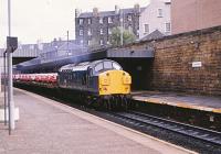 37068 westbound through Edinburgh Haymarket on 1 October 1982. The EE Type 3 was withdrawn in 1995 but lingered around for ten years in storage before being cut up at Booths, Rotherham in 2005<br><br>[Peter Todd 01/10/1982]