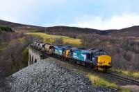 37218 and 37059 are running a little late as they haul their train of fourteen autoballasters south over Slochd Viaduct.This is the return working of 6K40 from Forsinard to Mossend.<br><br>[John Gray 19/11/2015]