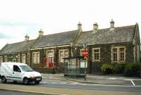 Closed in 1970 along with the line to Ilfracombe, the Barnstaple Town station building still stands on Castle Quay. Since closure, the restored structure has seen use as a restaurant and later as a school. The former station is seen here in June 2002. [See image 26577]<br><br>[Ian Dinmore 05/06/2002]