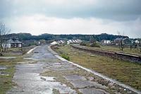 Rain is about to dampen the disused and crumbling platforms of Cromer High station on 2nd May 1976. There had been no trains here since 1960 when the site was used as a depot for materials scavenged from the recently closed M&GN system. Passenger trains ceased to call in 1954.<br><br>[Mark Dufton 02/05/1976]
