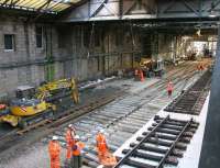 Replacing the crossover on the north side of Waverley in March 2006 prior to commencing construction of the new Balmoral through platform. View is east towards the temporary access created from Calton Road to bring in plant and materials. [See image 7435] <br><br>[John Furnevel 26/03/2006]