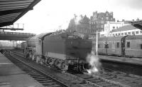 Gresley V2 2-6-2 no 60913 waiting for a train at Carlisle on 1 February 1964. The train in question is 9.25am Crewe - Perth. [See image 30719]<br><br>[K A Gray 01/02/1964]