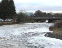 Some of the considerable activity taking place on and around the WCML viaduct at Lamington on the morning of 2 January 2016. Part of the structure has suffered due to the effects of recent heavy rainfall on the fast-flowing River Clyde during storm <I>Frank</I>. At the time of the photograph (1030) the rain had stopped, although surrounding roads and fields were saturated, with flooding apparent in several areas. The line will be closed for some time. [See image 54263]<br><br>[John Furnevel 02/01/2016]
