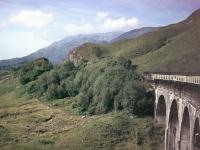 A BRCW Class 27 reaches the west end of Glenfinnan Viaduct heading for Mallaig in September 1977.<br><br>[Mark Bartlett 14/09/1977]