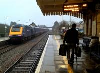 A hundred passengers leave, one arrives. An up HST heads South West, while passengers seated and walking await the Great Malvern DMU service. [See image 53799]<br><br>[Ken Strachan 02/01/2016]