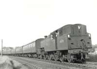 Fairburn 2-6-4T 42055 arriving at Lugton East Junction on 15 June 1961 The locomotive is heading for the sidings with the empty stock from an Uplawmoor train. <br><br>[G H Robin collection by courtesy of the Mitchell Library, Glasgow 15/06/1961]
