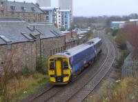 158701, after passing the closed Duddingston and Craigmillar station,  passes the former rail-served breweries.<br><br>[Bill Roberton
 05/01/2016]
