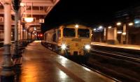 Freightliner 66517 heads the diverted 4L89 Coatbridge - Felixstowe containers through Kilmarnock station on 16 January 2016. This service is normally routed via Kilwinning.<br><br>[Ken Browne 16/01/2016]