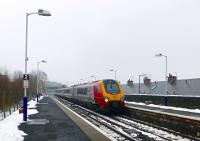 A displaced northbound Voyager passes at speed. A local expert (a bloke on the station) commented that he had not seen any 'dragged' Pendolinos, only Voyagers.<br><br>[Colin Miller 18/01/2016]