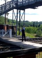 Aerobics for signalmen - a Highley regarded art. The signalman holds the token for the line to Bridgnorth aloft on 26th August [see also image 53092].<br><br>[Ken Strachan 26/08/2015]