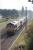 Heading back to Mossend after weekend engineering duties are DBS 66140, 66060, 66105 (in DBS red) and 66011. This image, looking towards Preston on Sunday 4th October 2015, was taken from the Cadley Causeway bridge. The former four track section here is now reduced to two running lines plus an Up Loop. <br><br>[Mark Bartlett 04/10/2015]