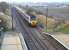 A chilly December morning in 2007, with frosty fields around Wallyford. Looking north from the footbridge as the first London train out of Aberdeen on a Sunday, the 0950 National Express East Coast HST service, is about to run through the station.<br><br>[John Furnevel 16/12/2007]