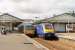 Pacer 143603, on a local service for Paignton, meets a Paddington bound HST at Newton Abbott station. 43009 is leading the London service and, on the far left, another Pacer can just be seen waiting to go forward to Exeter and Exmouth once the express has departed. <br><br>[Mark Bartlett 29/07/2015]