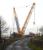 A large Ainscough scissor crane by Warehill Lane road overbridge work site between Tollerton and the A19 road. A new bridge has been installed, possibly to give W10 gauge clearance on the ECML slow lines, as part of a series of bridge replacement works on five consecutive bridges. Work began initially at both Station Lane, Shipton (by Beningbrough) and Forest Lane, Alne. As well as replacement of this bridge, work is currently being carried out at Chapmans Lane, next bridge south towards Shipton, with work yet to start on the final bridge at Station Road, Tollerton. Each bridge replacement rquires a near four month road closure, hence a staggered pattern of work to maintain near at hand diversion routes around the work area. <br><br>[David Pesterfield 29/12/2015]