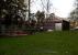 Another view [see image 53815] of Tetbury goods shed, this time from the station end. A heritage minus is that the sleepers in the grass are not totally original; a heritage plus is that the cattle dock appears to be under restoration.<br><br>[Ken Strachan 24/12/2015]