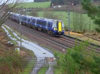 380 106 nears Dalry with a southbound service.  Evidence of much lost trackage.<br><br>[Bill Roberton
 09/02/2016]