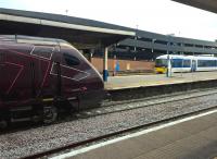A fleeting meeting at Banbury on 28 December 2015. The Voyager will travel to Southampton via Oxford and Reading; while the Clubman will go to London Marylebone along the GW/GC route. The bright brake discs make the Voyager wheels look especially small.<br><br>[Ken Strachan 28/12/2015]