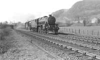 An up West Highland train passing through Dumbuck on Saturday 12 April 1958 with Black 5 44787 piloting K2 61786. The train has just passed below the lattice girder bridge carrying the L&D line between Bowling and Dumbarton. [See image 52480]   <br><br>[G H Robin collection by courtesy of the Mitchell Library, Glasgow 12/04/1958]