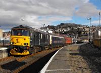 The Caledonian Sleeper at Oban, diverted from Fort William due to engineering works, topped and tailed with Class 73s. With the arrival of the new stock it is possible the sleeper may split at Crianlarich with portions for Fort William and Oban. Photograph courtesy of Doug Carmichael of the <a target='external' href='http://www.westhighlandline.org.uk/'>Friends of the West Highland Lines</a>.<br><br>[Doug Carmichael 14/02/2016]