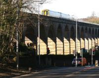 The 1211 (Sunday) Edinburgh Waverley - Tweedbank crossing Newbattle Viaduct in bright sunshine on 28 February 2016. The train has approximately half a mile to run to its next stop at Newtongrange.<br><br>[John Furnevel 28/02/2016]