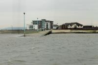 The slipway at Knott End, seen from the ferry crossing from Fleetwood on 29th February 2016. The substantially rebuilt Knott End Railway terminus can be seen to the right of the slipway entrance [See image 18813] next to the coastguard station. <br><br>[Mark Bartlett 29/02/2016]