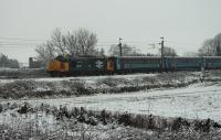 The light overnight covering of snow was already beginning to thaw (and it was raining) as 37401 <I>Mary Queen of Scots</I> headed north at Brock with the Northern Rail 1005hrs (M-F) Preston to Barrow-in-Furness service on 4th March 2016. <br><br>[Mark Bartlett 04/03/2016]