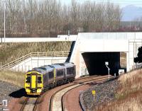 A northbound service on the Borders Railway about to pass below the Edinburgh City Bypass on 28 February 2016. The train is the 1031 ex Tweedbank, which has a mile to run to its next stop at Shawfair.<br><br>[John Furnevel 28/02/2016]