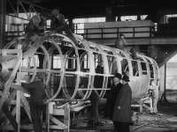 This is a frame from 'The George Bennie Railplane System of Transport', courtesy of the BFI National Archive.<br><br>
The image shows the railplane's 'car' under construction. The location is the Inchinnan aircraft Factory where rigid airships were built from 1915 to 1921.<br><br>
The full film is on the <a target=external href=http://player.bfi.org.uk/film/watch-the-george-bennie-railplane-system-of-transport-1930/>BFI Player</a>.<br><br>[Courtesy of the BFI National Archive //1929]