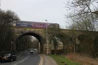 A Northern 153/150 combination crosses the Raikes Viaduct, immediately south of the site of Lower Darwen station, with a Clitheroe to Manchester Victoria service on 11th March 2016. <br><br>[Mark Bartlett 11/03/2016]
