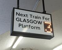 Pared-down departure information in the platform subway at Paisley Gilmour Street for passengers in a hurry. Interestingly the font appears to be a type of Johnson associated solely with former London Transport applications: sign maybe sourced from LUL?<br><br>[David Panton 05/03/2016]