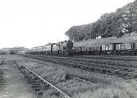 Fowler 2P 4-4-0 40689 approaching Kilwinning from the north on 4 July 1959 with a train from St Enoch destined for Ardrossan Town. [Ref query 4531]<br><br>[G H Robin collection by courtesy of the Mitchell Library, Glasgow 04/07/1959]