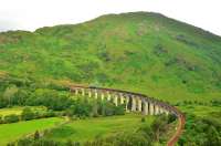 K1 No.62005 crossing Glenfinnan Viaduct with the morning Jacobite service in July 6th 2012.The now completed path up to the view point is still being constructed,passing under the last arch of the viaduct on the left.<br><br>[John Gray 06/07/2012]