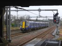 380 020 takes the bi-directional centre road through Cardonald with a fast Ayr - Glasgow service.<br><br>[Bill Roberton 18/03/2016]