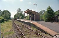 View west at Llanwrda Level Crossing. This station had staggered platforms and the disused former westbound platform is behind the camera.<br><br>[Ewan Crawford //2002]