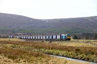 68018 Vigilant has been hauling the Mossend-Inverness container train for most of this week. Pictured north of Moy.<br><br>[John Gray 25/03/2016]