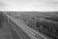 View east from the A70 road bridge of the WCML.  Beyond, the ground is being prepared for Ravenstruther coal loading terminal.  By 2016 it would be closed and demolished.  <br><br>[Bill Roberton //1988]