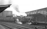 Ivatt class 2MT 41264 of Upperby shed with Edge Hill Black 5 45307 standing with a train at Carlisle platform 4 on Saturday 25 September 1965. Details of the particular working are not known.<br><br>[K A Gray 25/09/1965]