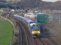 DBS 68003 passes Burntisland links with the evening Cardenden - Mossend empty stock working.  The loco is passing over the severed link to the docks.<br><br>[Bill Roberton 05/04/2016]