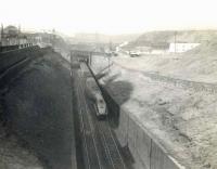Scene on Cowlairs Incline on 11 May 1955, with A4 Pacific 60031 <I>Golden Plover</I> descending with a train towards Queen Street. (The more distant of the two bridges in the background carried a connection from the Port Dundas Branch to Tennant's Works, off to the right.)<br><br>[G H Robin collection by courtesy of the Mitchell Library, Glasgow 11/05/1955]